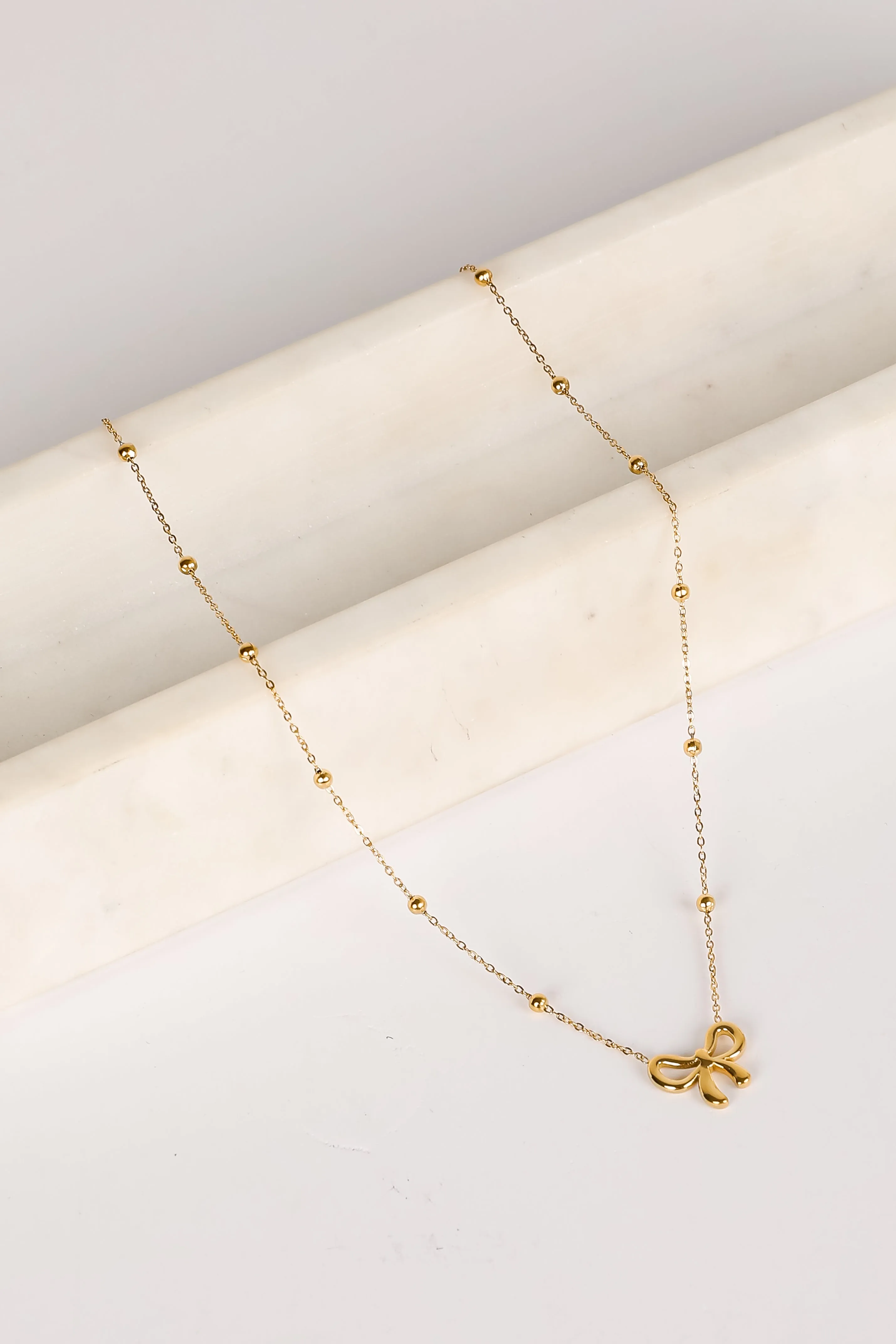 Elizabeth Gold Bow Charm Necklace