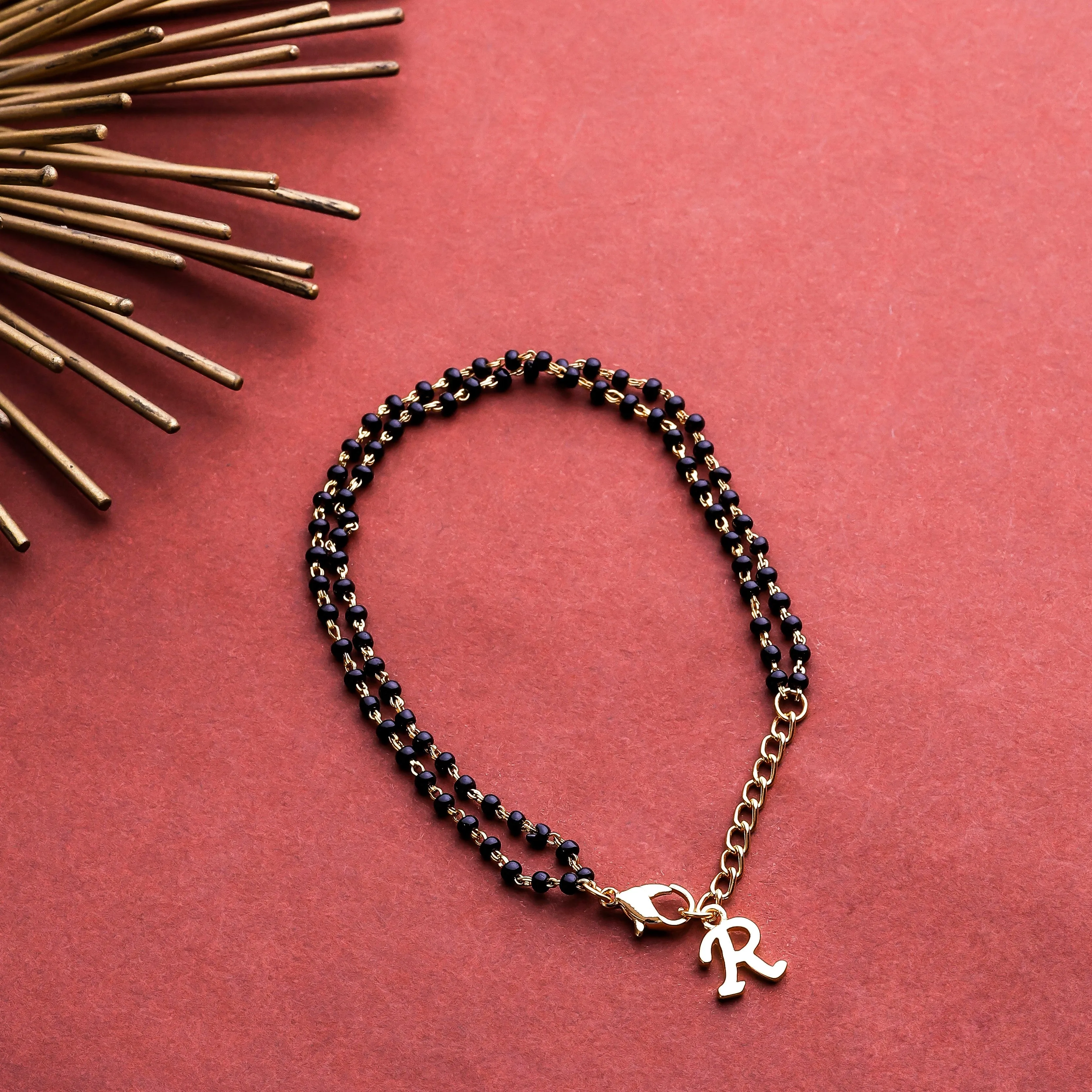 Estele Gold Plated Stylish Personalized "R" Letter Mangalsutra Charm Bracelet with Black Beads for Women